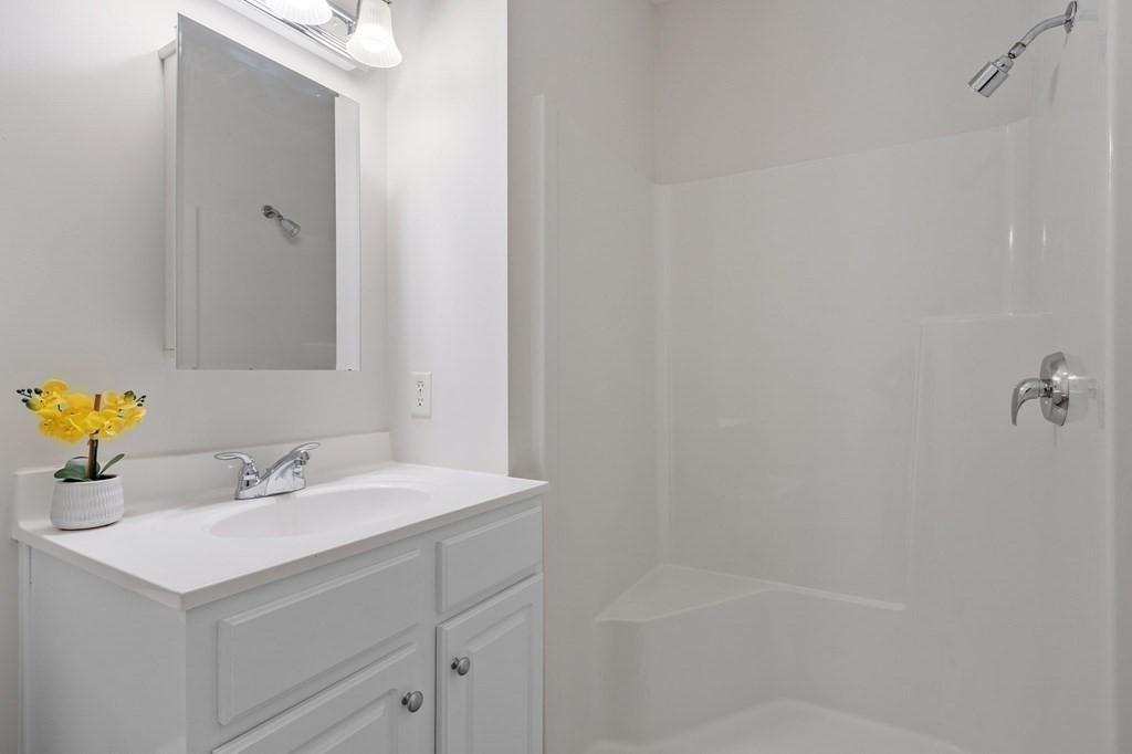 190 Chickering Road, Unit 208D North Andover, MA 01845 - Photo 25 of 42 a bathroom with a sink and a mirror