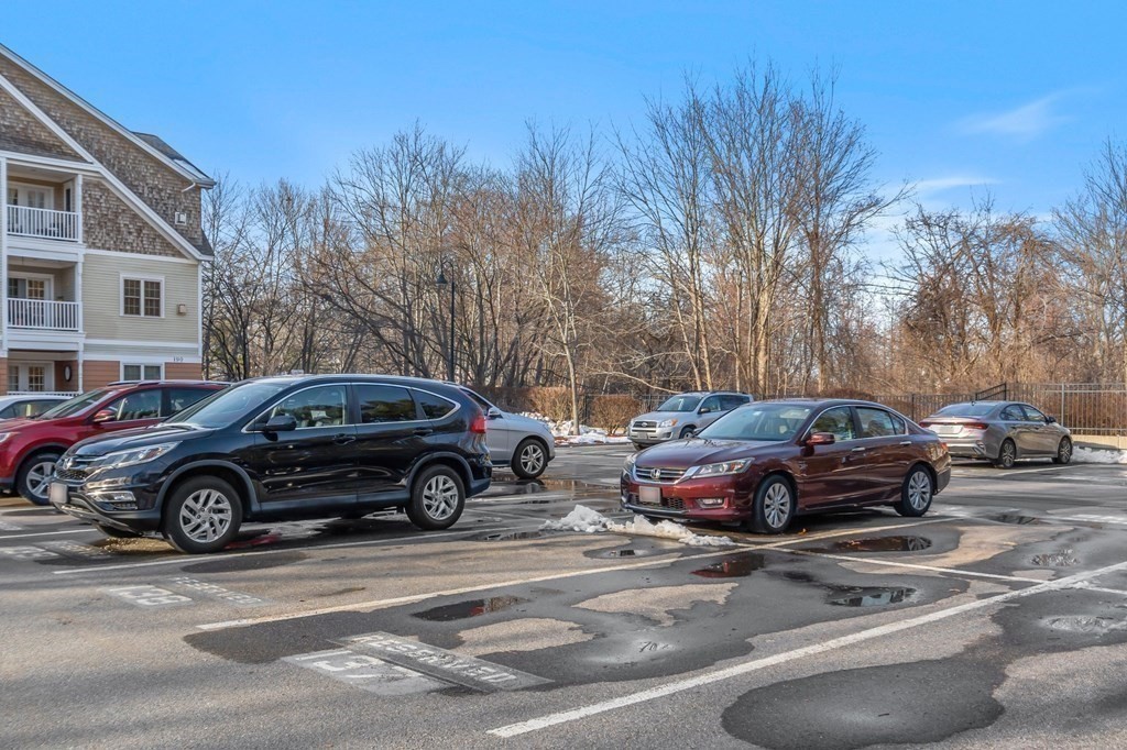 190 Chickering Road, Unit 208D North Andover, MA 01845 - Photo 32 of 42 a car parked in front of a house