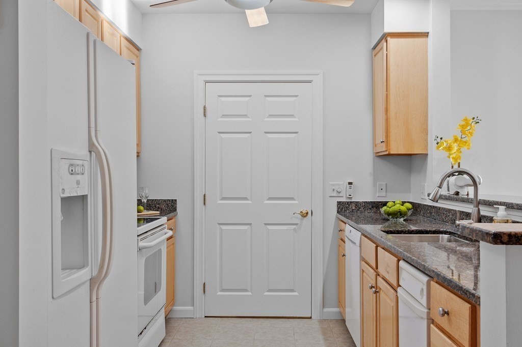 190 Chickering Road, Unit 208D North Andover, MA 01845 - Photo 4 of 42 a bathroom with a granite countertop sink and a granite top