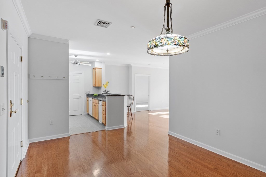 190 Chickering Road, Unit 208D North Andover, MA 01845 - Photo 8 of 42 a view of a room with a chandelier