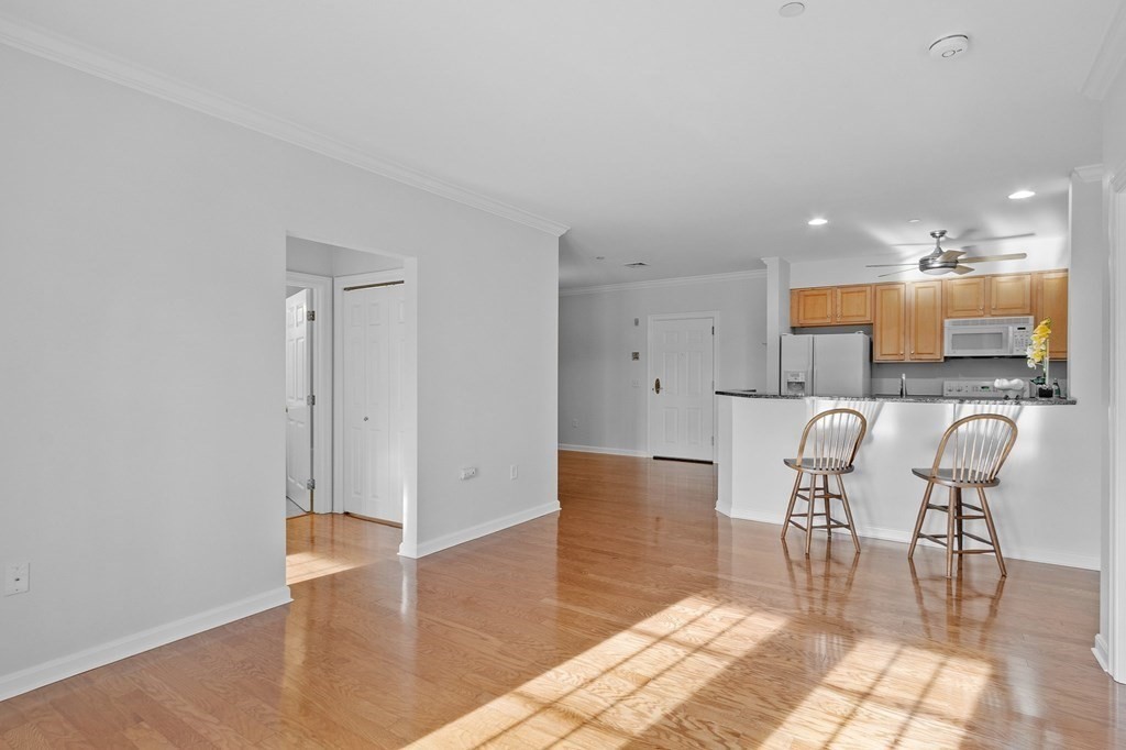 190 Chickering Road, Unit 208D North Andover, MA 01845 - Photo 10 of 42 a view of kitchen with granite countertop cabinets table and chairs