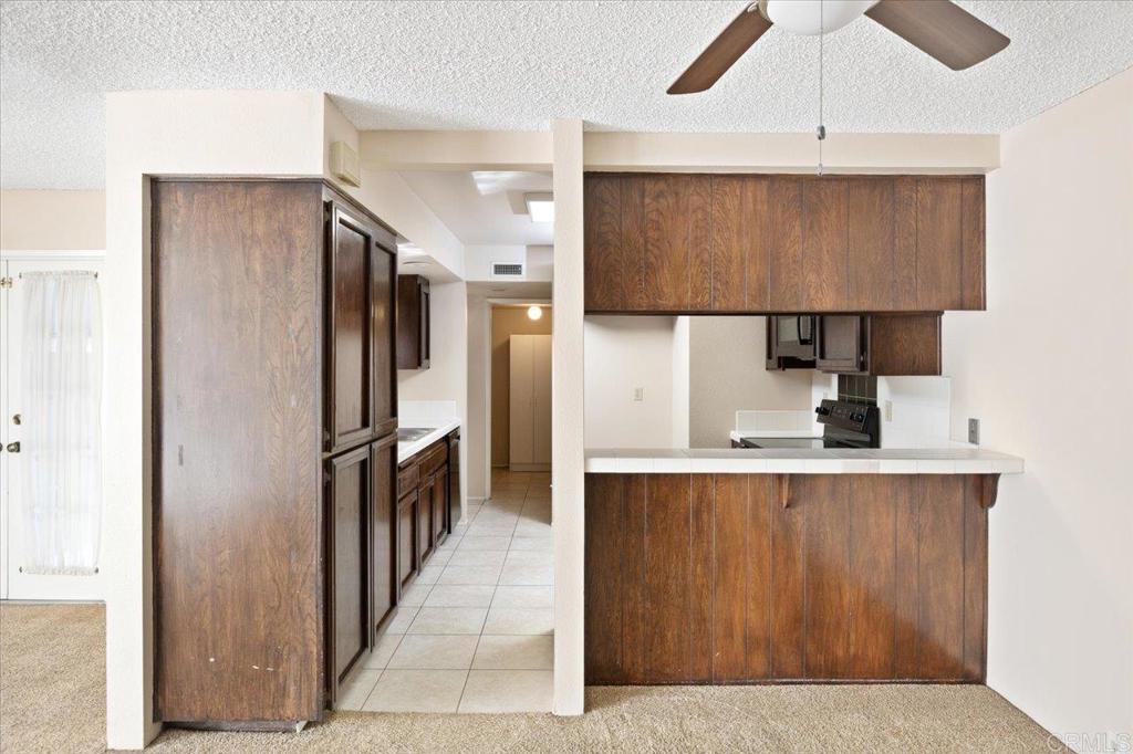 17523 Fairlie Road San Diego, CA 92128 - Photo 13 of 33 a kitchen with stainless steel appliances a refrigerator and a sink