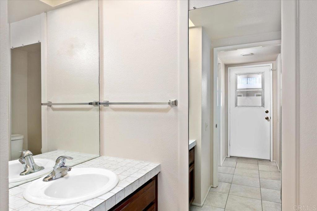 17523 Fairlie Road San Diego, CA 92128 - Photo 18 of 33 a bathroom with a sink and a mirror