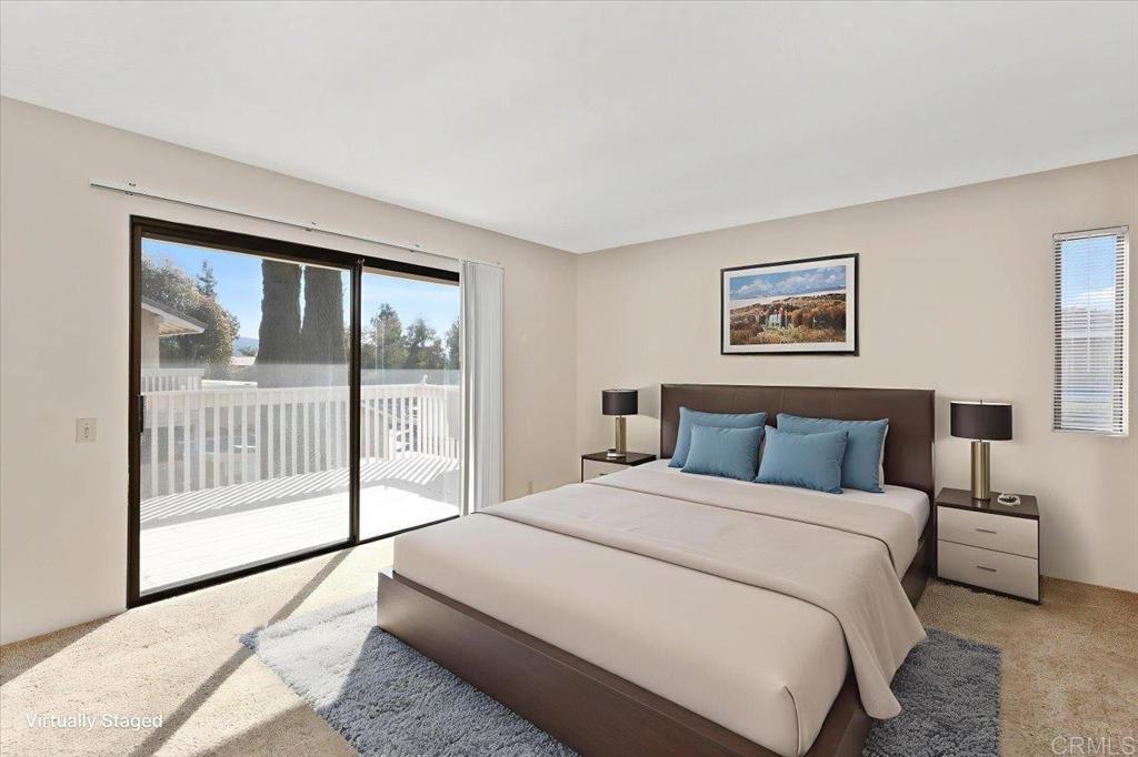 17523 Fairlie Road San Diego, CA 92128 - Photo 21 of 33 a bedroom with a large bed and a large window
