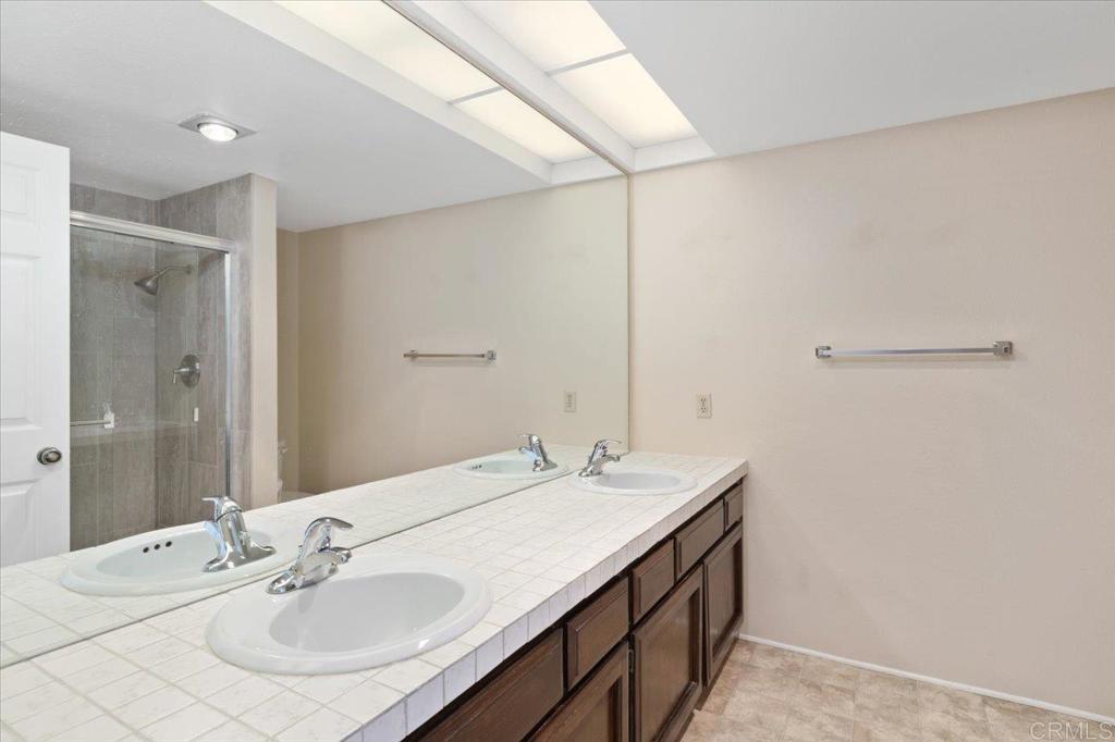 17523 Fairlie Road San Diego, CA 92128 - Photo 26 of 33 a bathroom with a sink and a mirror