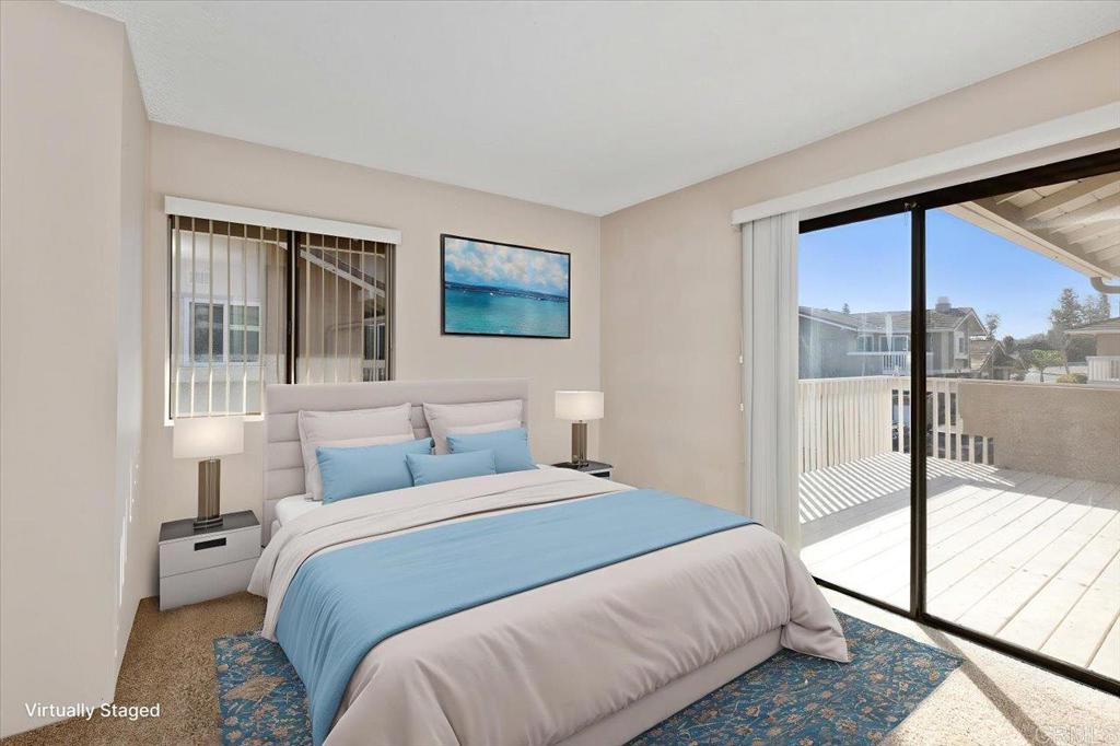17523 Fairlie Road San Diego, CA 92128 - Photo 27 of 33 a bedroom with a large bed and a large window with outer view