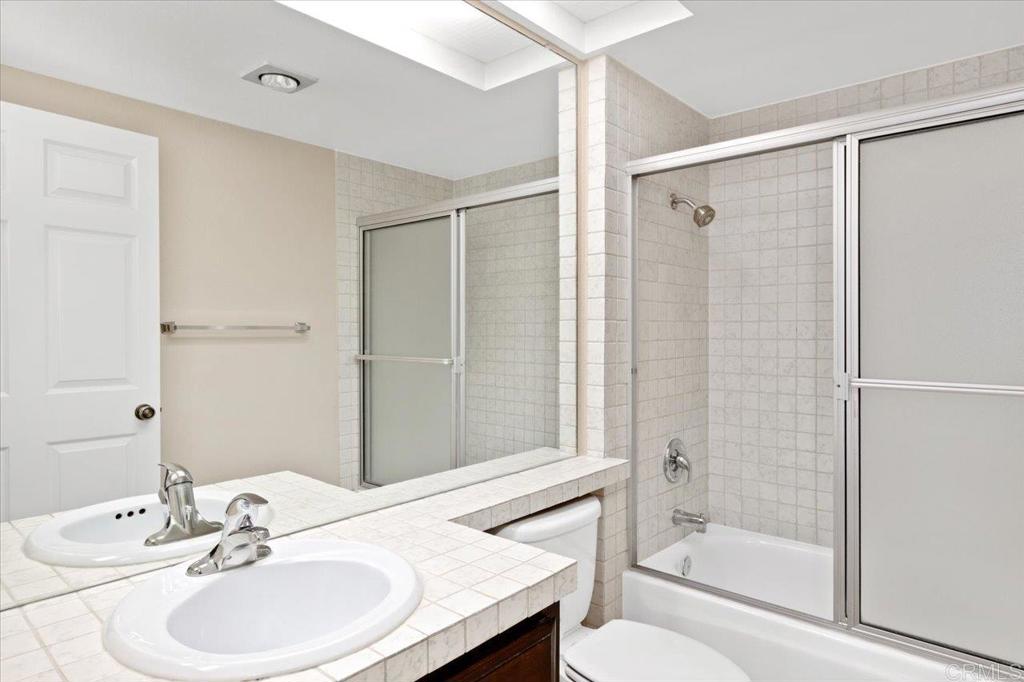17523 Fairlie Road San Diego, CA 92128 - Photo 30 of 33 a bathroom with a sink toilet and shower