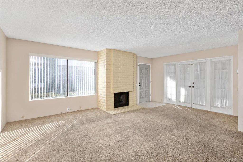 17523 Fairlie Road San Diego, CA 92128 - Photo 7 of 33 a view of a livingroom with a fireplace