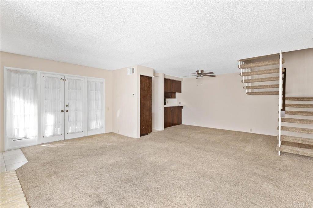 17523 Fairlie Road San Diego, CA 92128 - Photo 8 of 33 a view of empty room with a ceiling fan