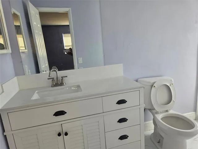a bathroom with a shower and window