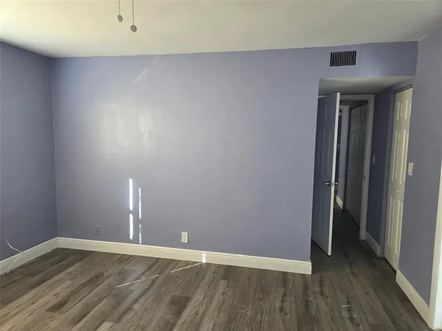 a bathroom with a sink and mirror with toilet