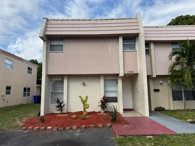 a bed room with a bed and potted plant