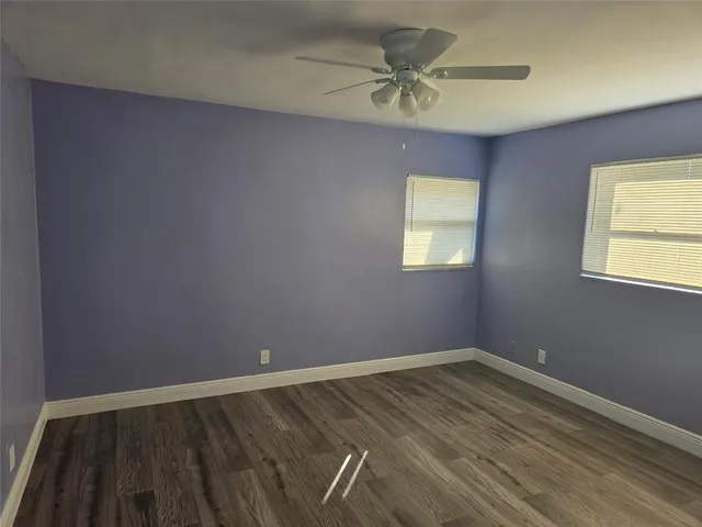a kitchen with cabinets and stainless steel appliances