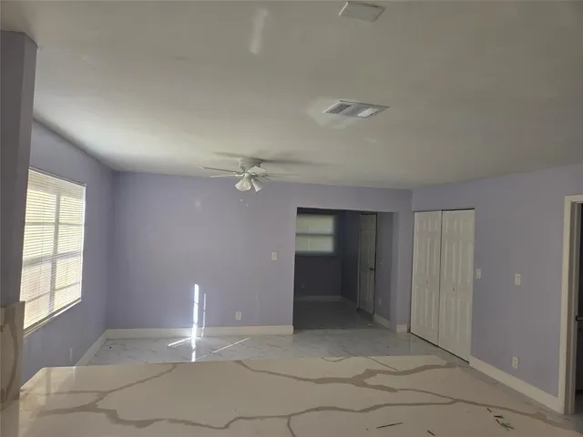 a kitchen with granite countertop a refrigerator and a stove