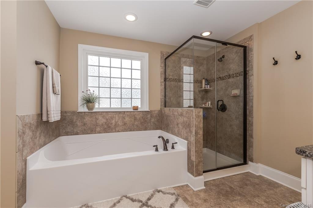 79180 Ridgehaven Road Lancaster, SC 29720 - Photo 15 of 24 a bathroom with a bathtub and shower