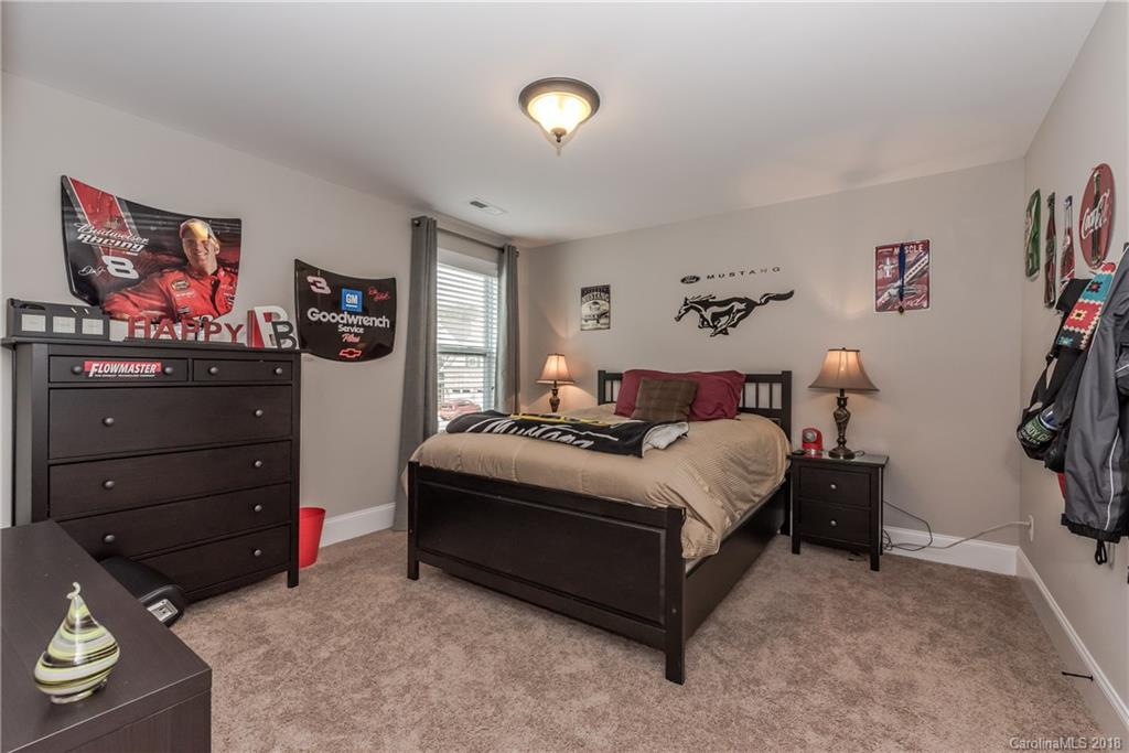 79180 Ridgehaven Road Lancaster, SC 29720 - Photo 18 of 24 a bedroom with a bed and a dresser