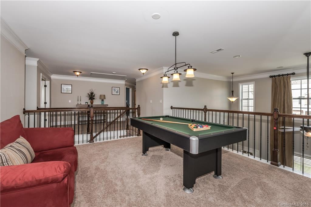 79180 Ridgehaven Road Lancaster, SC 29720 - Photo 22 of 24 a living room with furniture a table and a chandelier