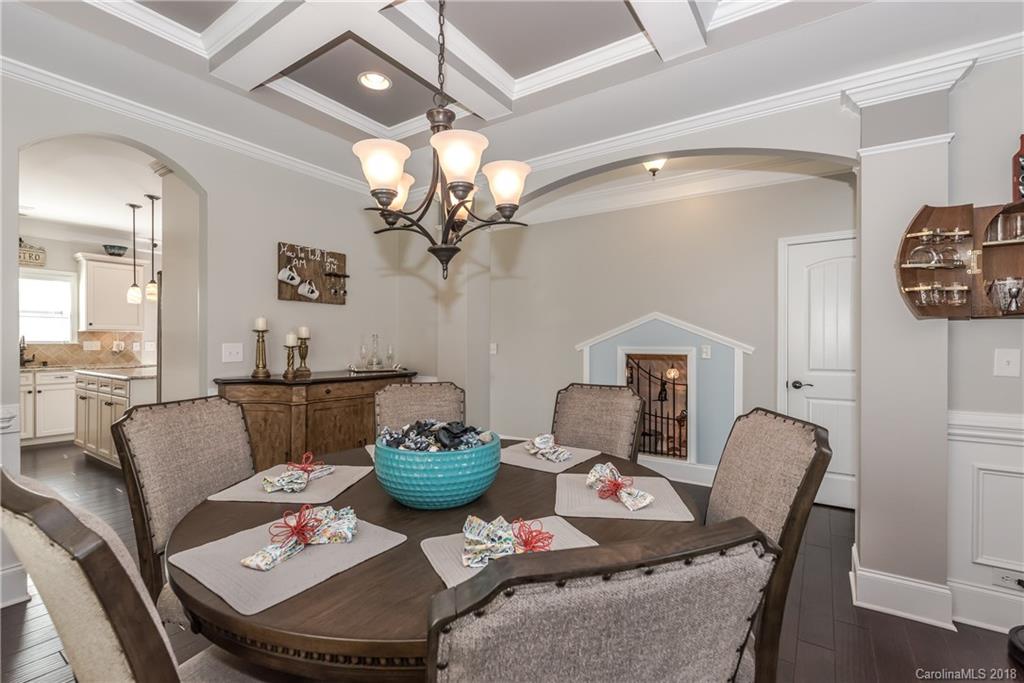 79180 Ridgehaven Road Lancaster, SC 29720 - Photo 4 of 24 a living room with furniture a chandelier and a dining room