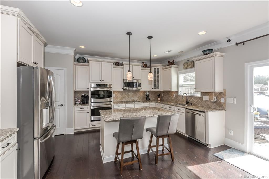 79180 Ridgehaven Road Lancaster, SC 29720 - Photo 5 of 24 a kitchen with kitchen island a sink stove and refrigerator