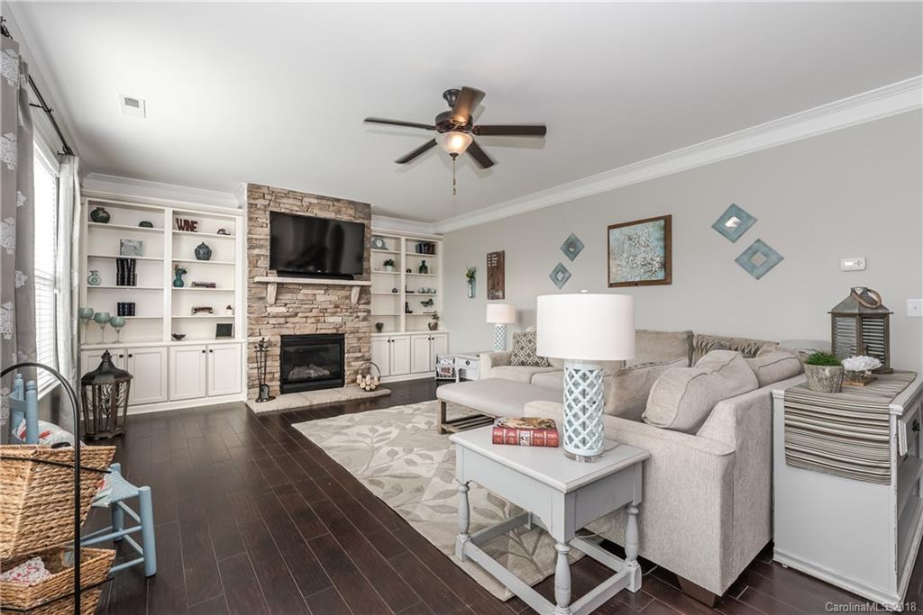 79180 Ridgehaven Road Lancaster, SC 29720 - Photo 7 of 24 a living room with furniture a fireplace and a flat screen tv