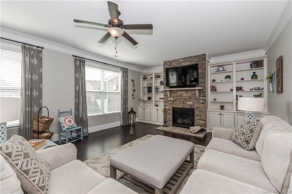 79180 Ridgehaven Road Lancaster, SC 29720 - Photo 8 of 24 a living room with furniture a flat screen tv and a fireplace