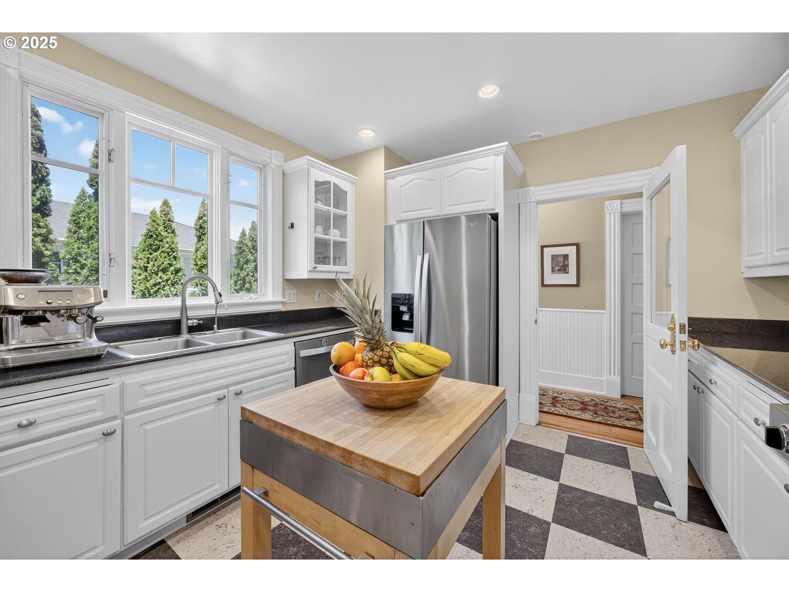496 Beach Street Ashland, OR 97520 - Photo 14 of 45 a kitchen with stainless steel appliances granite countertop a sink and a refrigerator