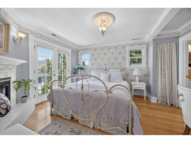 a bedroom with a bed couch and window