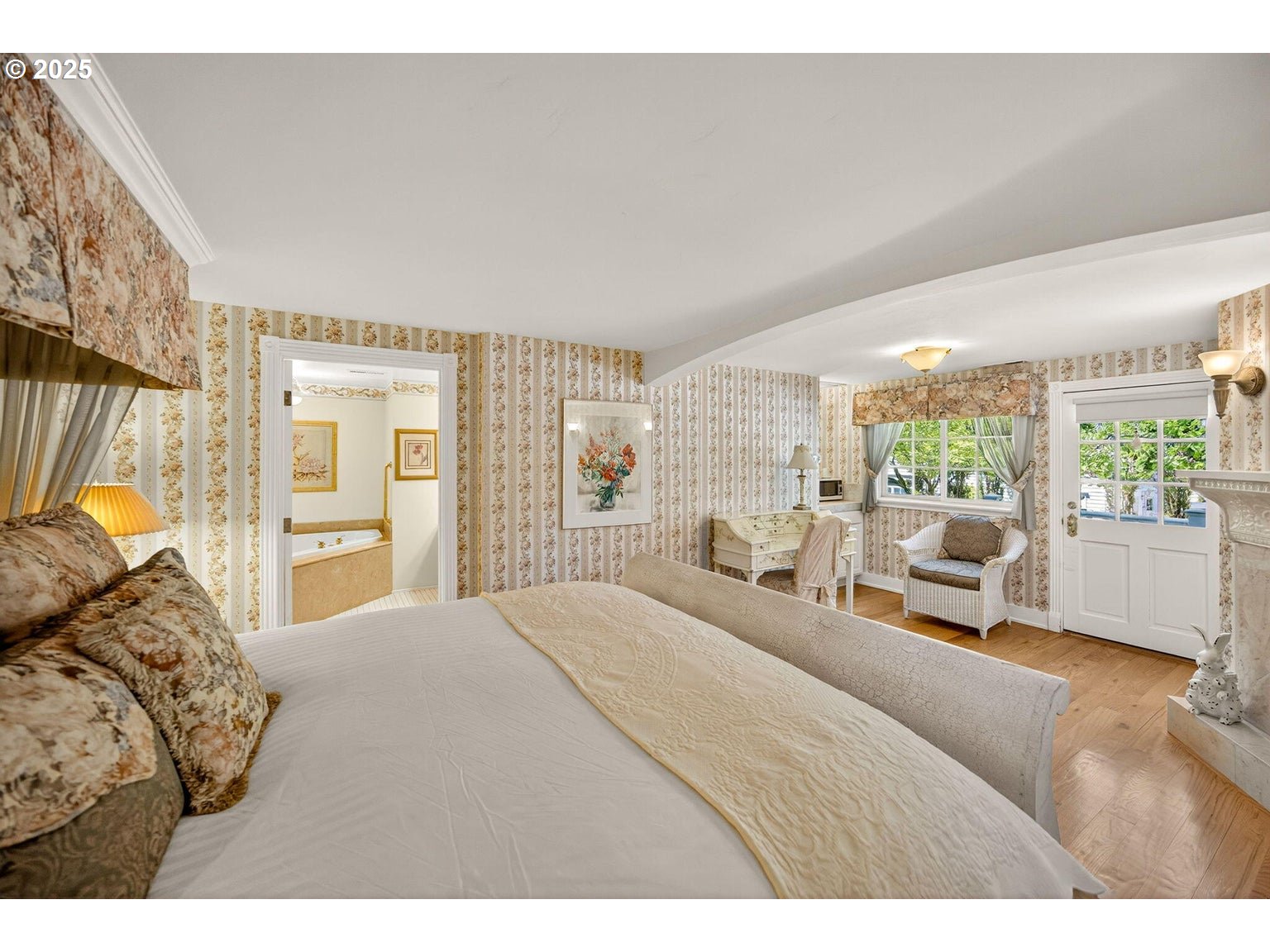 496 Beach Street Ashland, OR 97520 - Photo 26 of 45 a bedroom with a large bed and a large window with outer view