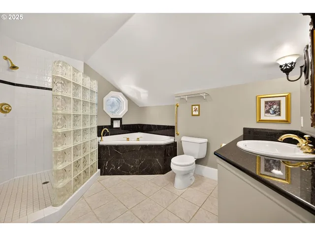 a bedroom with a bed couch and window