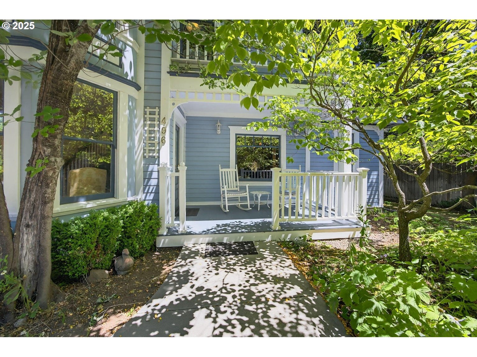 496 Beach Street Ashland, OR 97520 - Photo 5 of 45 a view of a house with a small yard and wooden fence