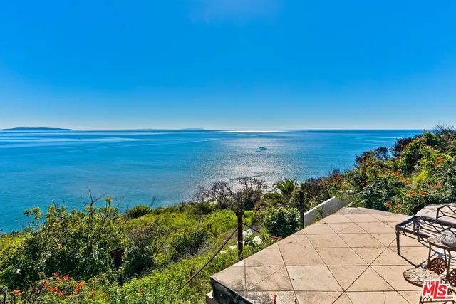 a view of a lake with a building in the background