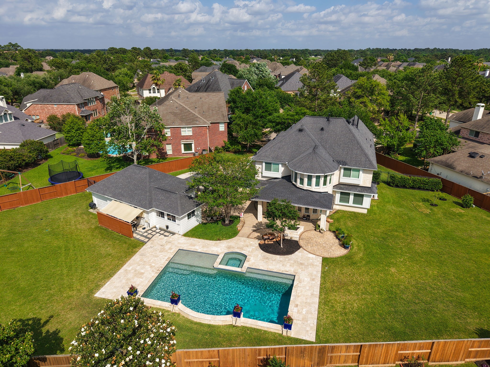Aerial photo shows just how well the home is positioned on the expansive lot. Great for sports enthusiasts. Plenty of room on both sides of this home!