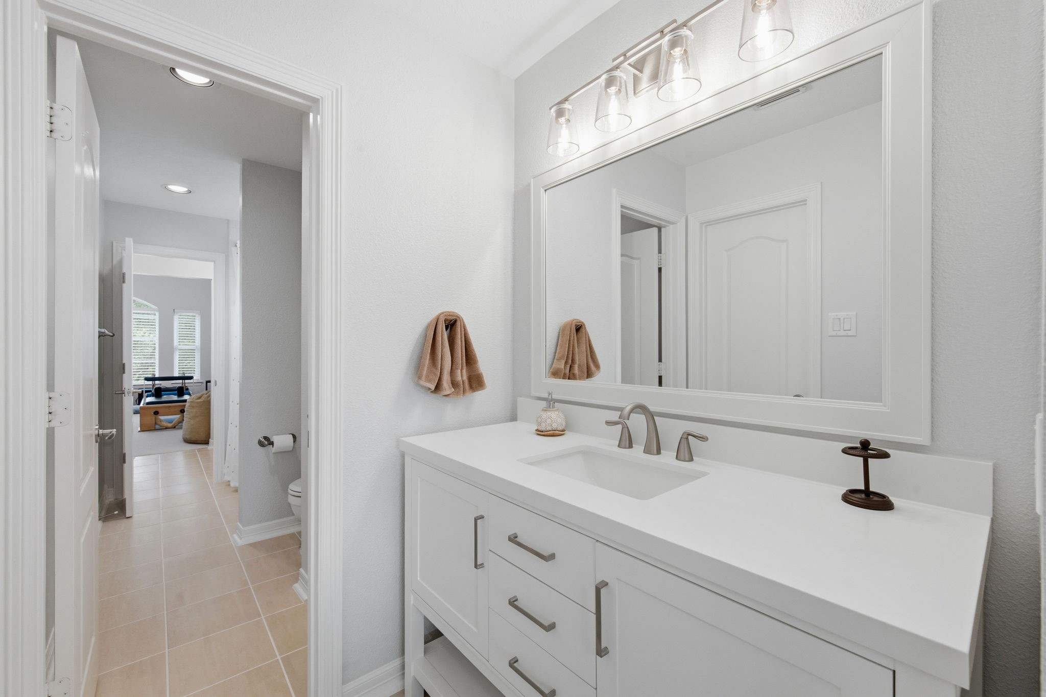 10203 Noble Pointe Court Spring, TX 77379 - Photo 20 of 50 Jack and Jill bath with newer vanity, faucet, mirror and lighting.