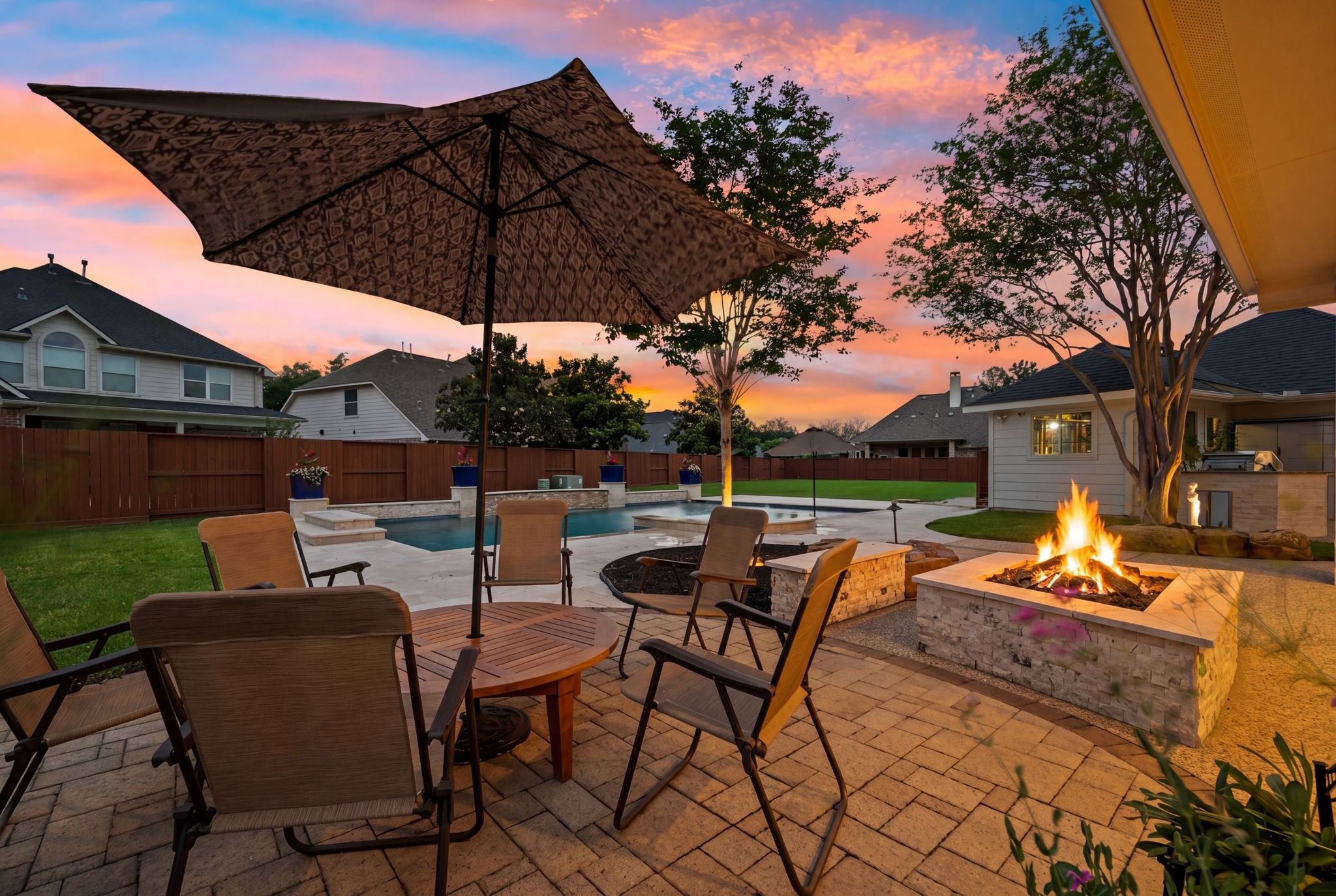 10203 Noble Pointe Court Spring, TX 77379 - Photo 42 of 50 Natural gas firepit with paver surround.