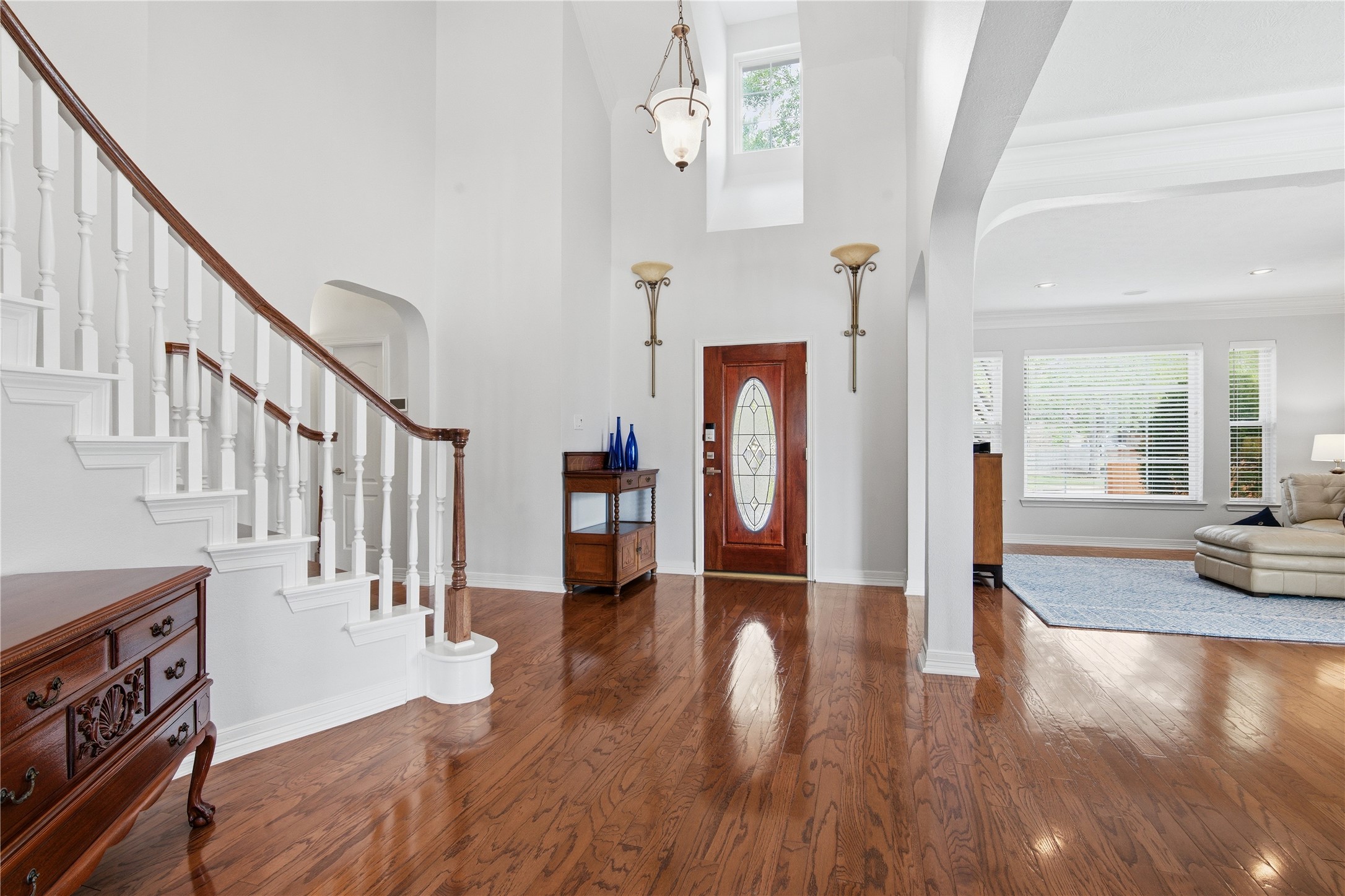 10203 Noble Pointe Court Spring, TX 77379 - Photo 6 of 50 Two story foyer with scone lighting and neutral paint