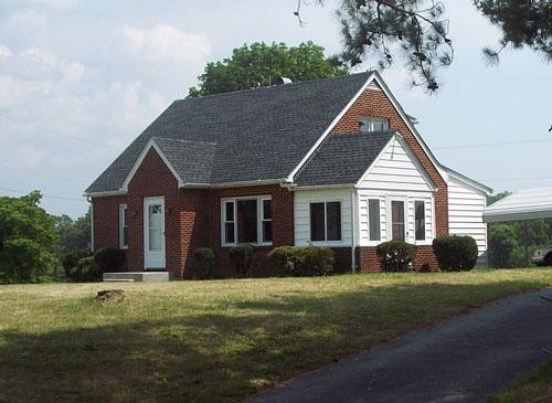 9890 Stewartsville Road Goodview, VA 24095 - Photo 1 of 16 a front view of house with yard and green space