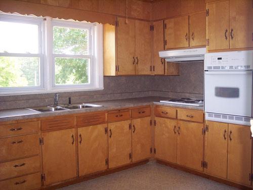 9890 Stewartsville Road Goodview, VA 24095 - Photo 8 of 16 a kitchen with a sink stove and cabinets