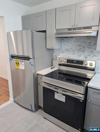 a kitchen with a stove and a microwave