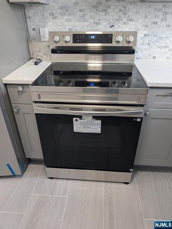 205 Bergen Turnpike, Unit 2E Ridgefield Park, NJ 07660 - Photo 5 of 9 a stove top oven sitting inside of a kitchen