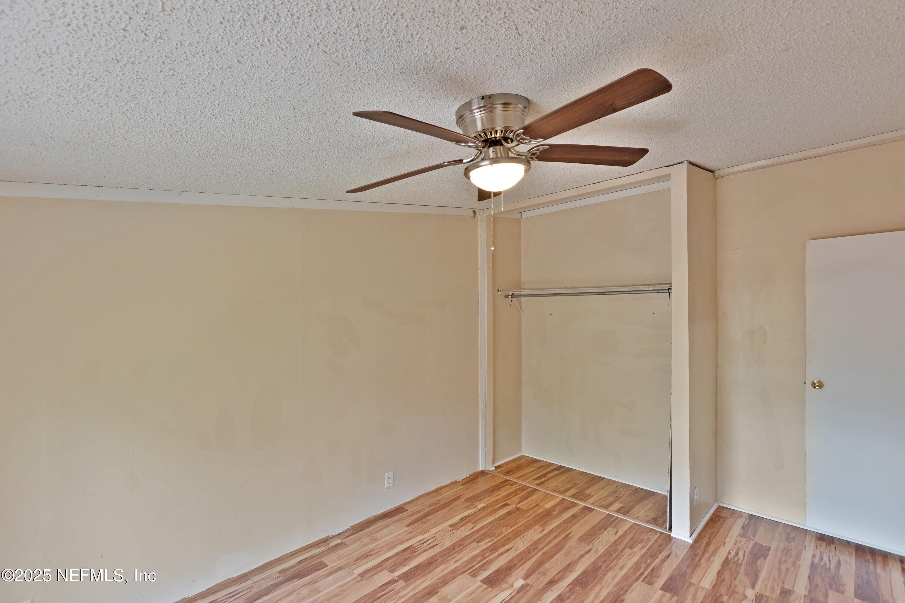 7463 Lilly Court Keystone Heights, FL 32656 - Photo 14 of 24 a view of empty room with wooden floor