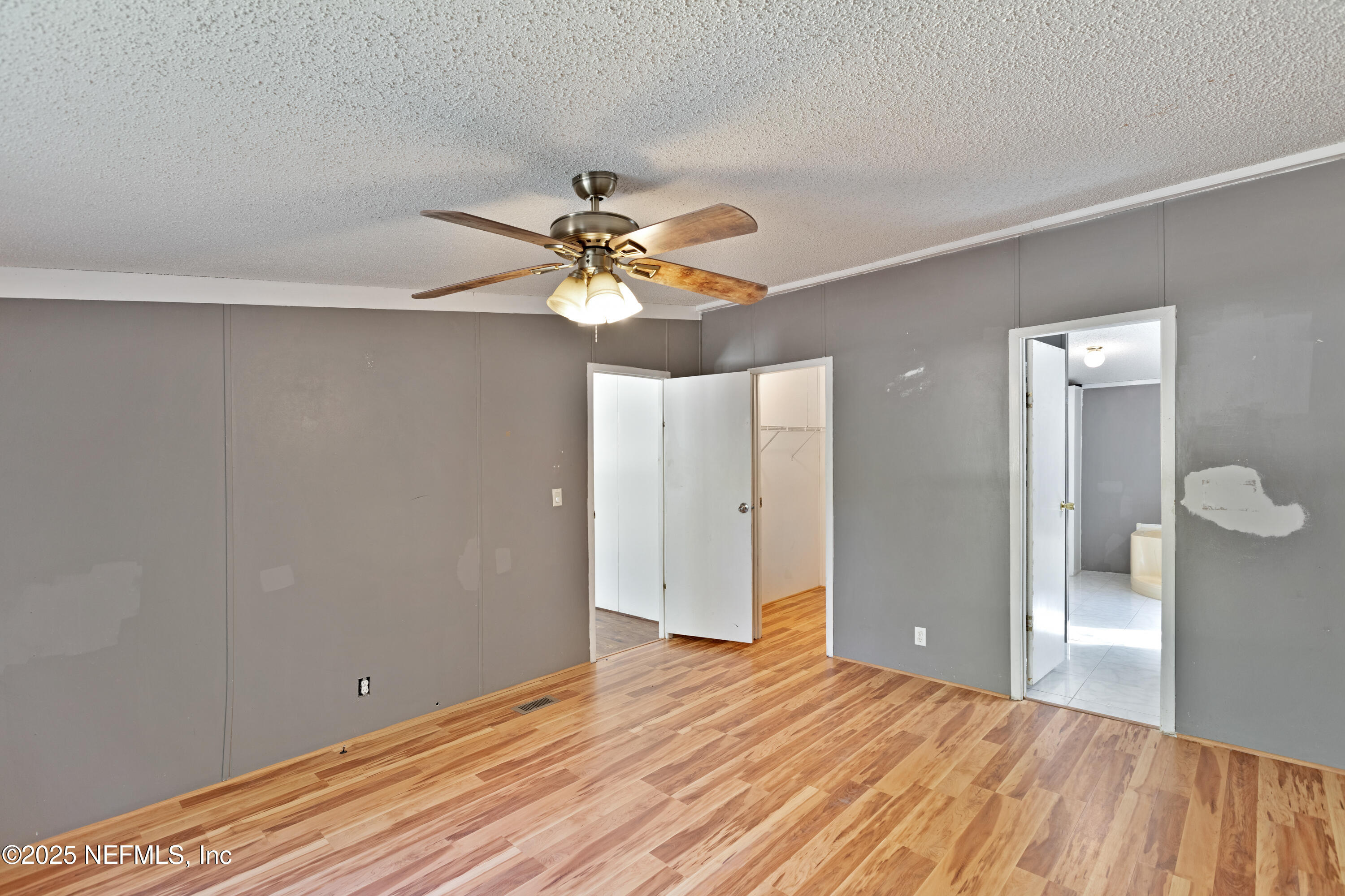 7463 Lilly Court Keystone Heights, FL 32656 - Photo 18 of 24 a view of empty room with wooden floor