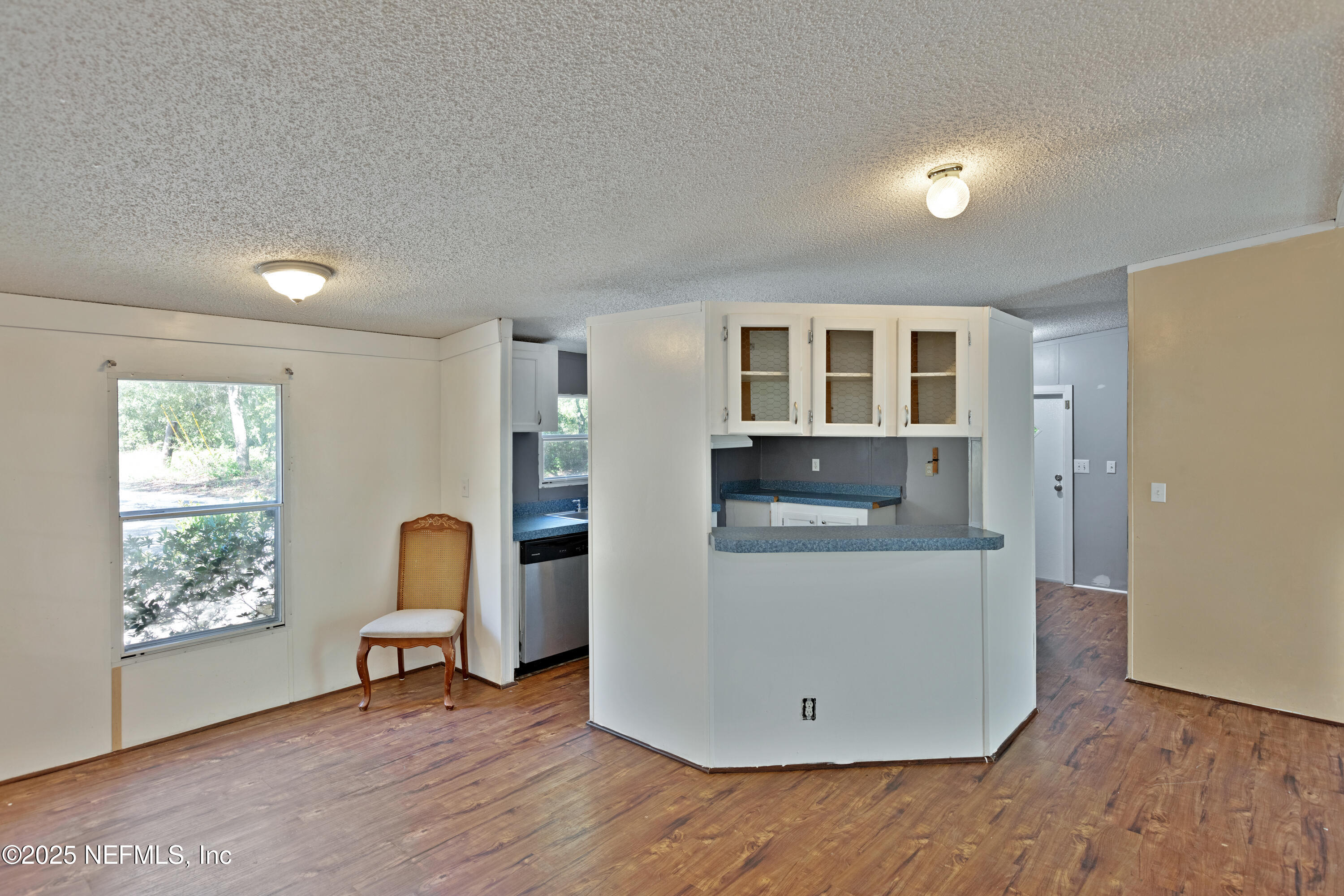 7463 Lilly Court Keystone Heights, FL 32656 - Photo 5 of 24 a view of livingroom with furniture and wooden floor