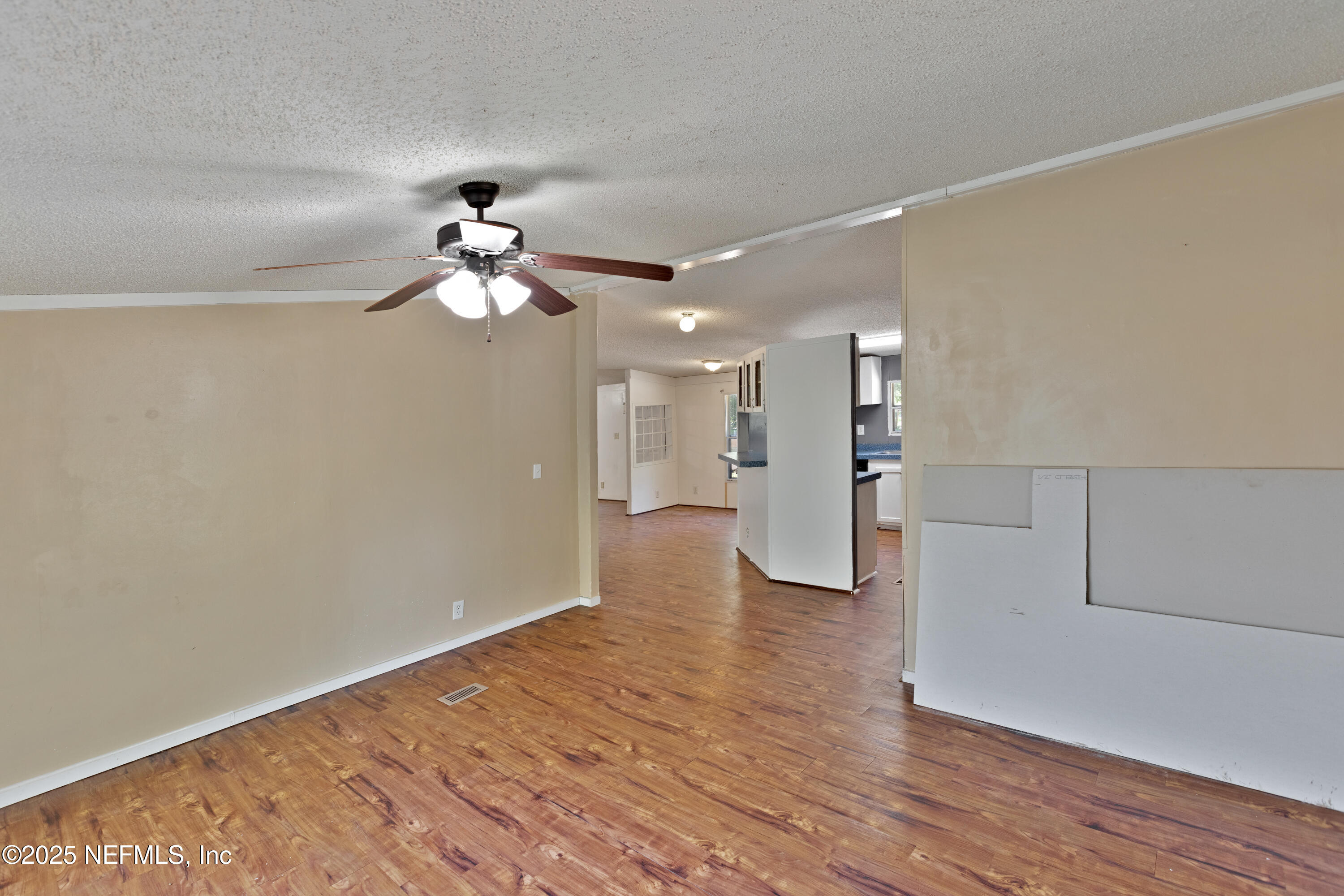 7463 Lilly Court Keystone Heights, FL 32656 - Photo 10 of 24 a view of an empty room and wooden floor