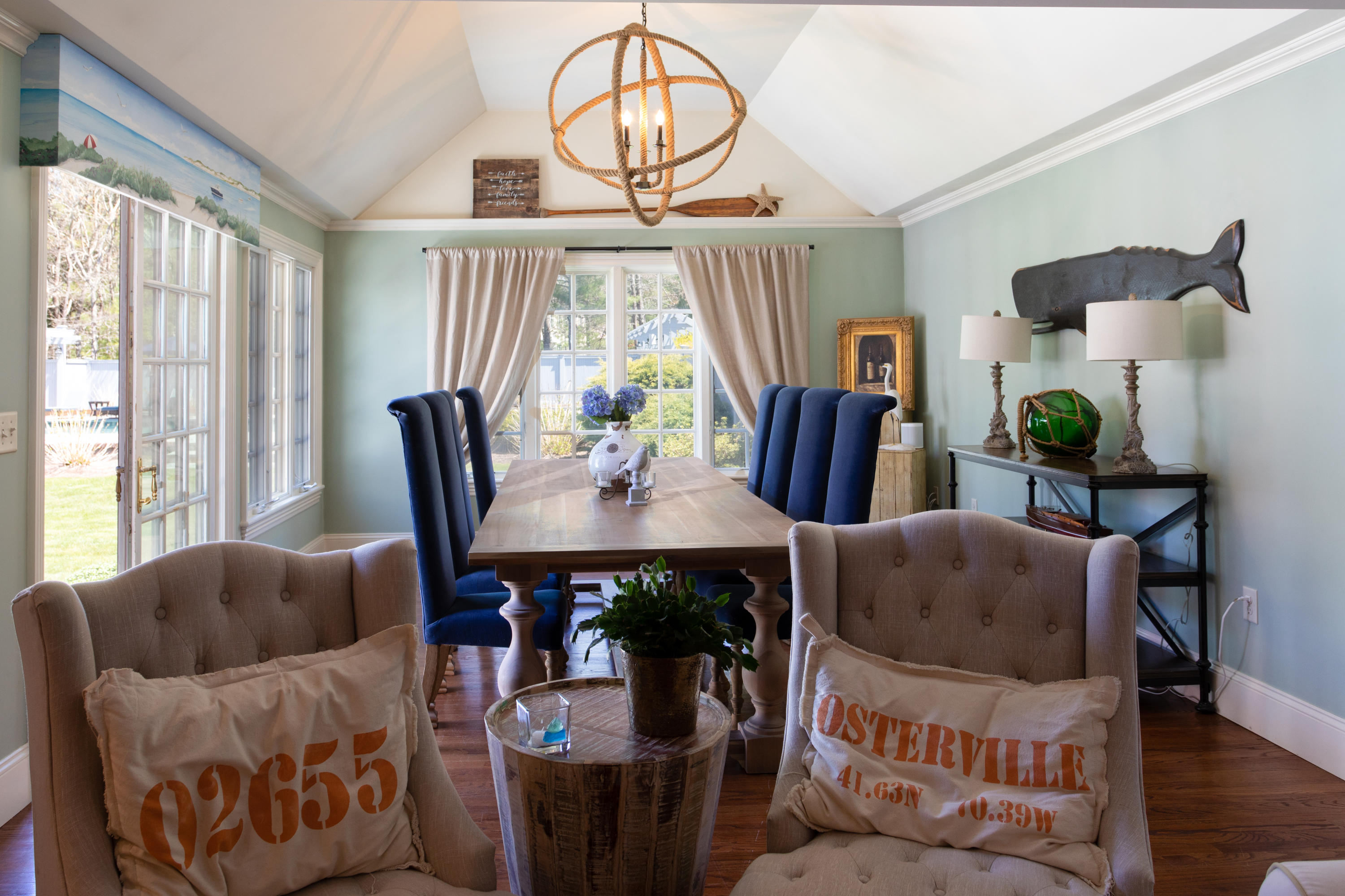120 Smoke Valley Road Osterville, MA 02655 - Photo 11 of 64 a living room with furniture a table and a large window