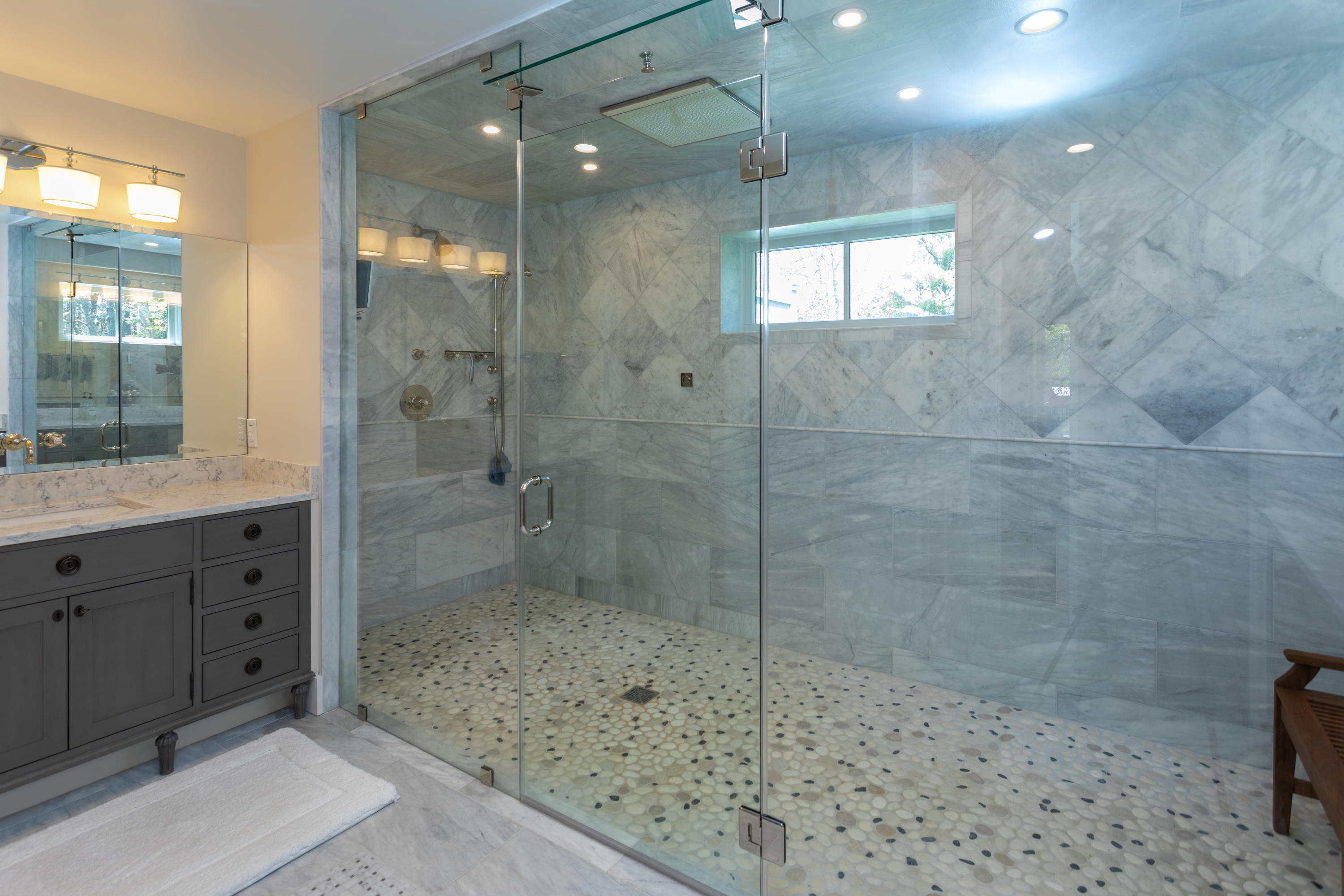 120 Smoke Valley Road Osterville, MA 02655 - Photo 24 of 64 a bathroom with a shower sink and mirror
