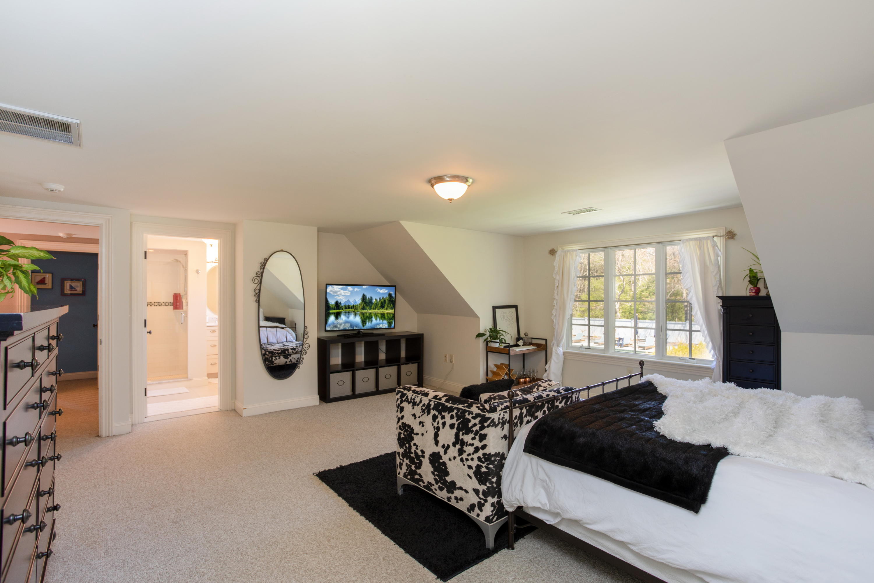120 Smoke Valley Road Osterville, MA 02655 - Photo 28 of 64 a bedroom with a large bed and a large window