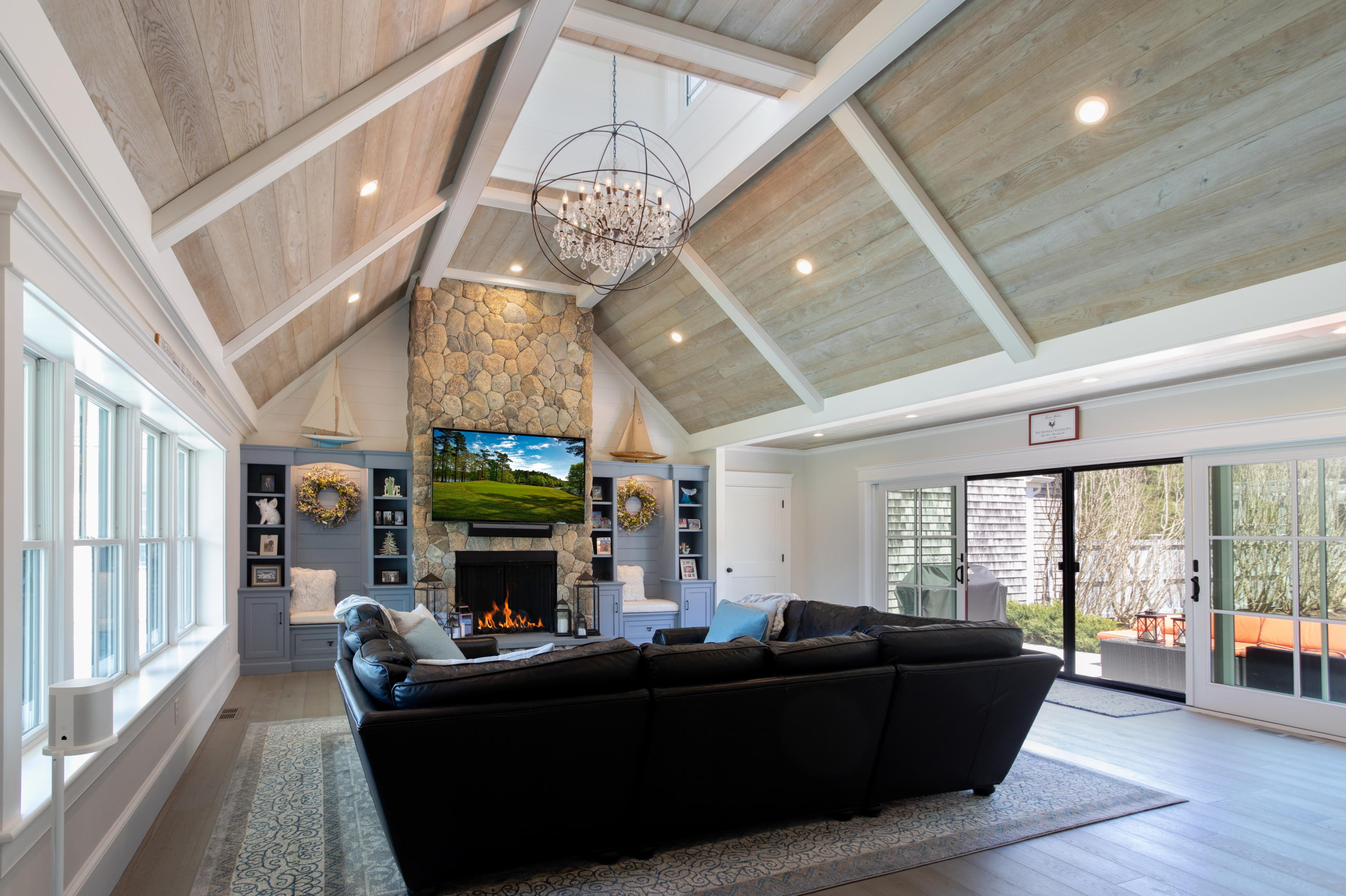 120 Smoke Valley Road Osterville, MA 02655 - Photo 3 of 64 a living room with furniture and a fireplace
