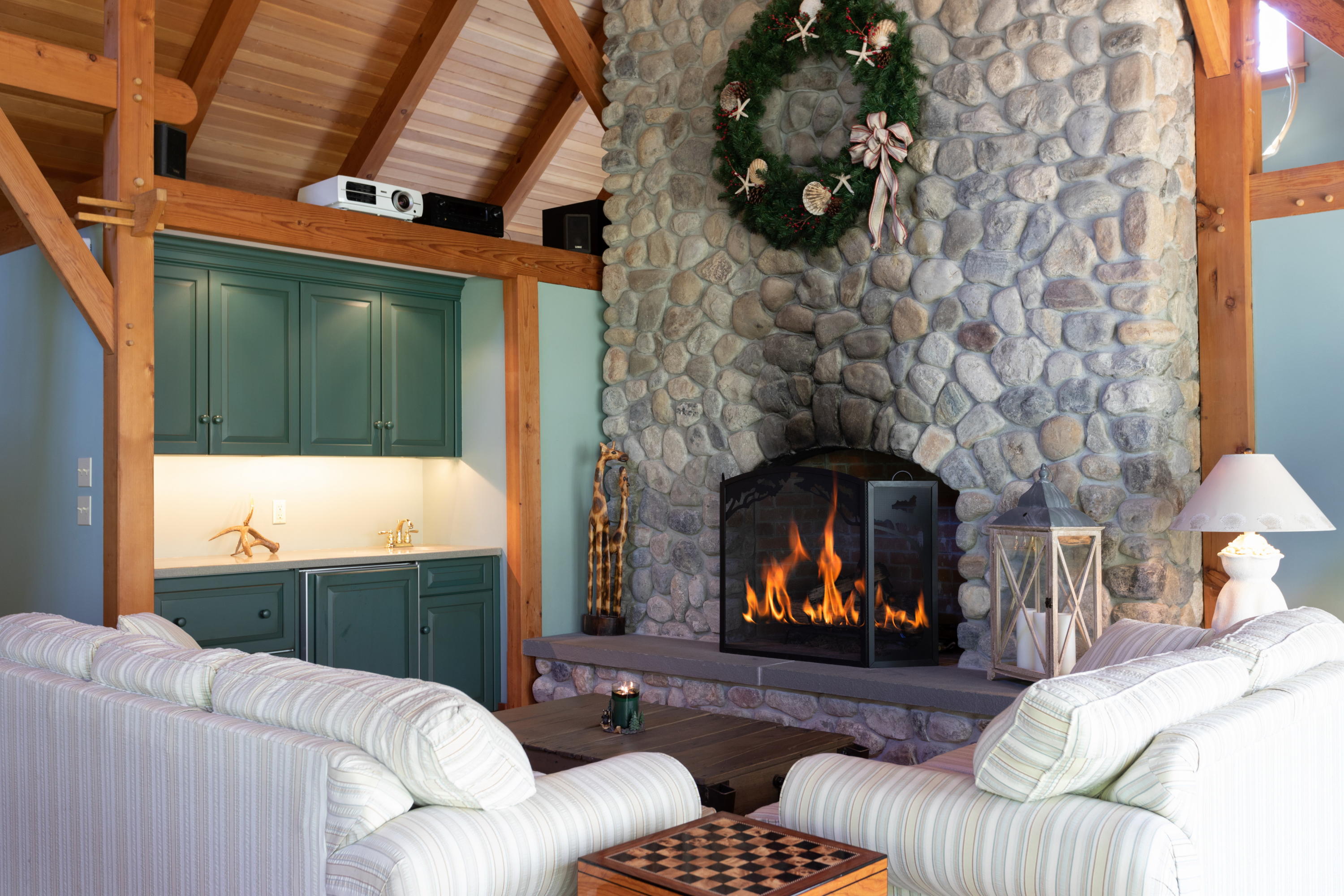 120 Smoke Valley Road Osterville, MA 02655 - Photo 36 of 64 a living room with furniture and a fireplace