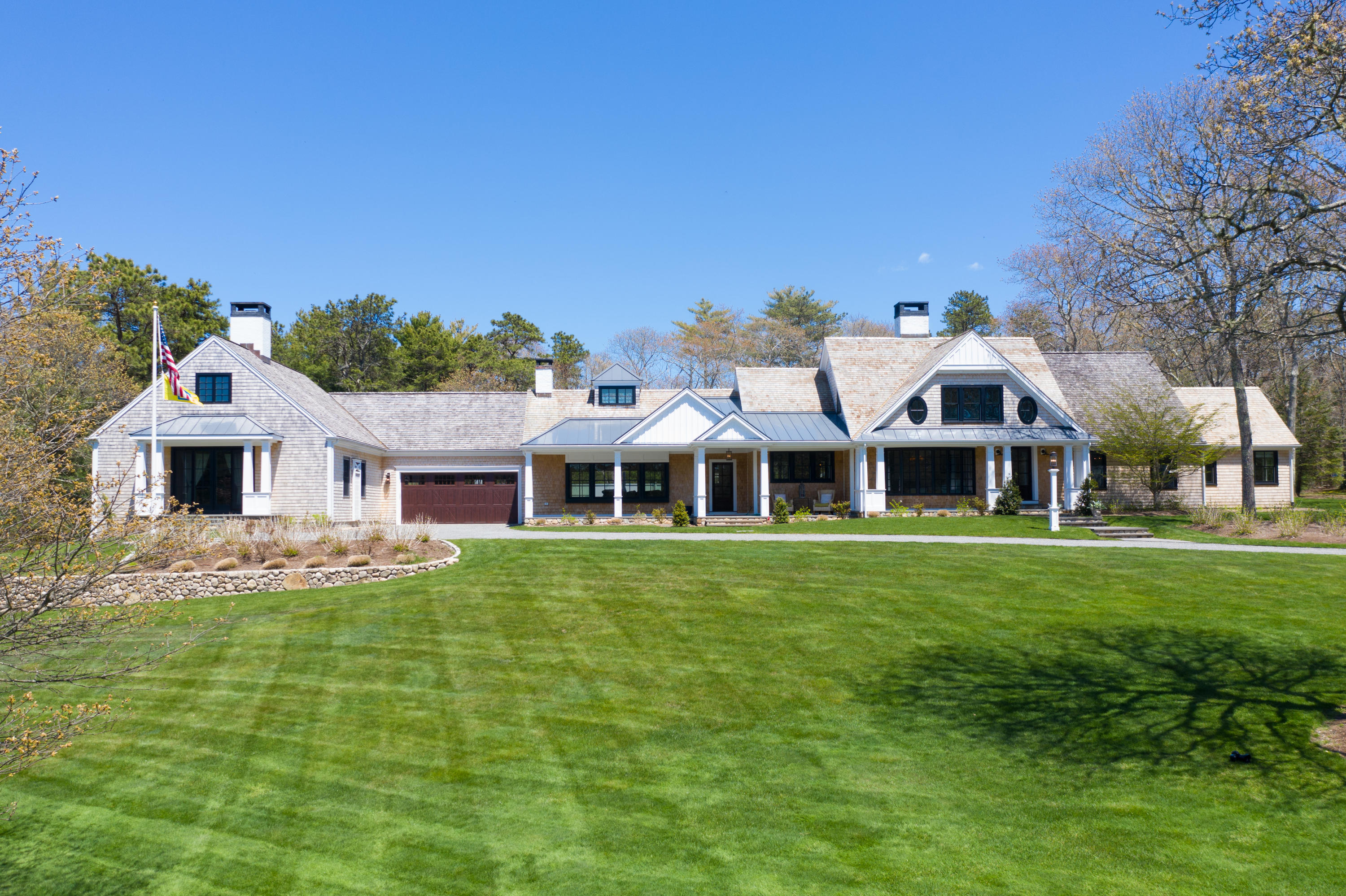 120 Smoke Valley Road Osterville, MA 02655 - Photo 50 of 64 a front view of a house with a garden
