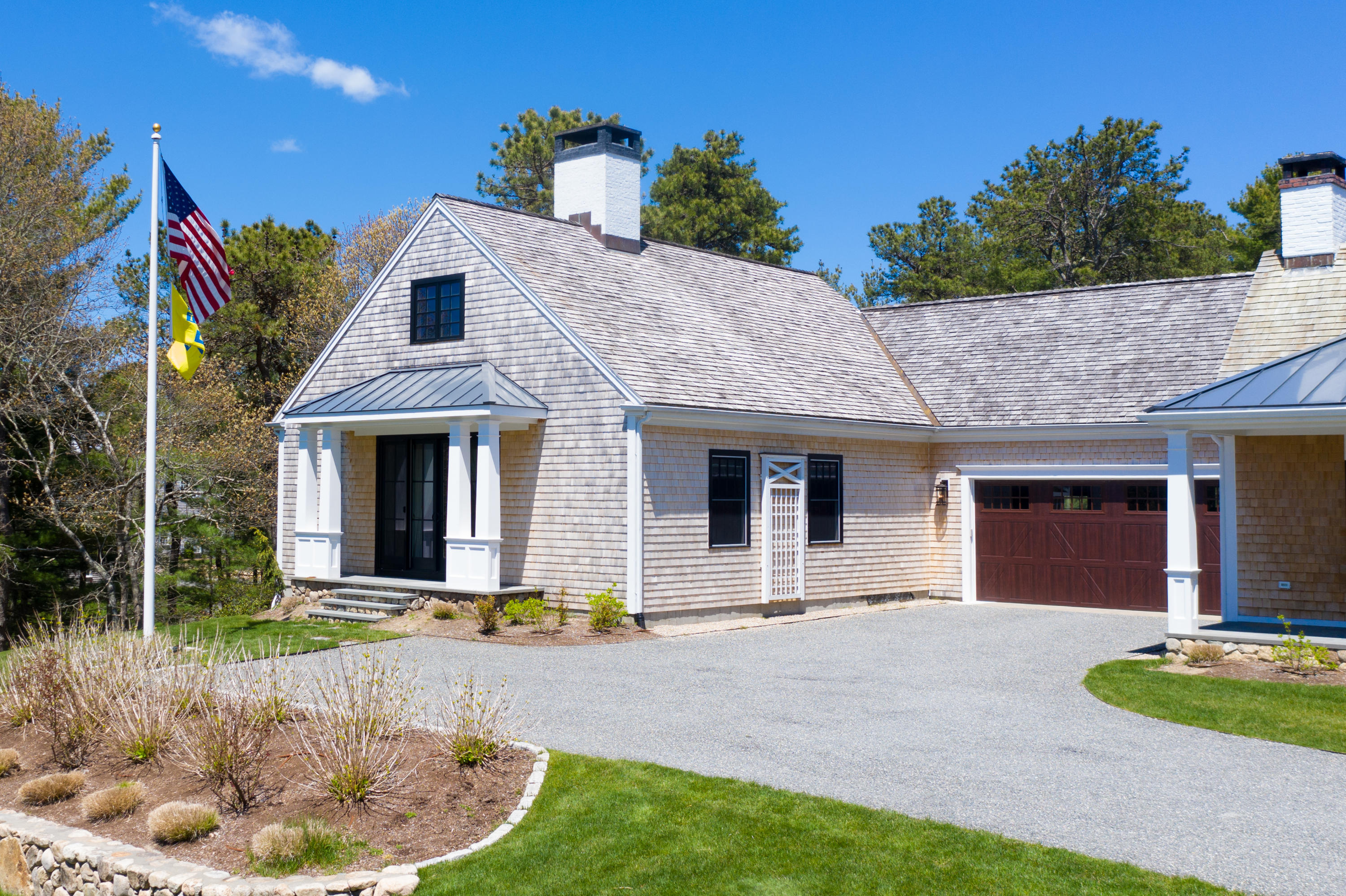 120 Smoke Valley Road Osterville, MA 02655 - Photo 55 of 64 a front view of a house with garden